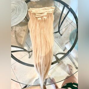 9 piece clip in set, real human hair 24 inches. Wore them twice